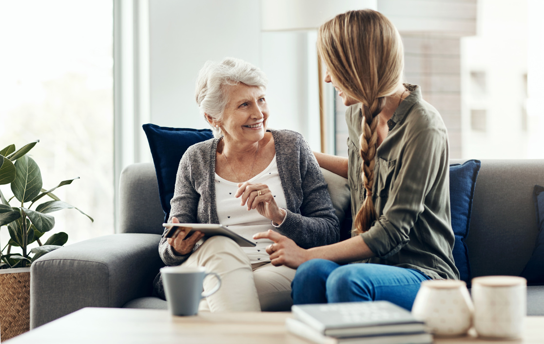 Senior woman talking to another woman