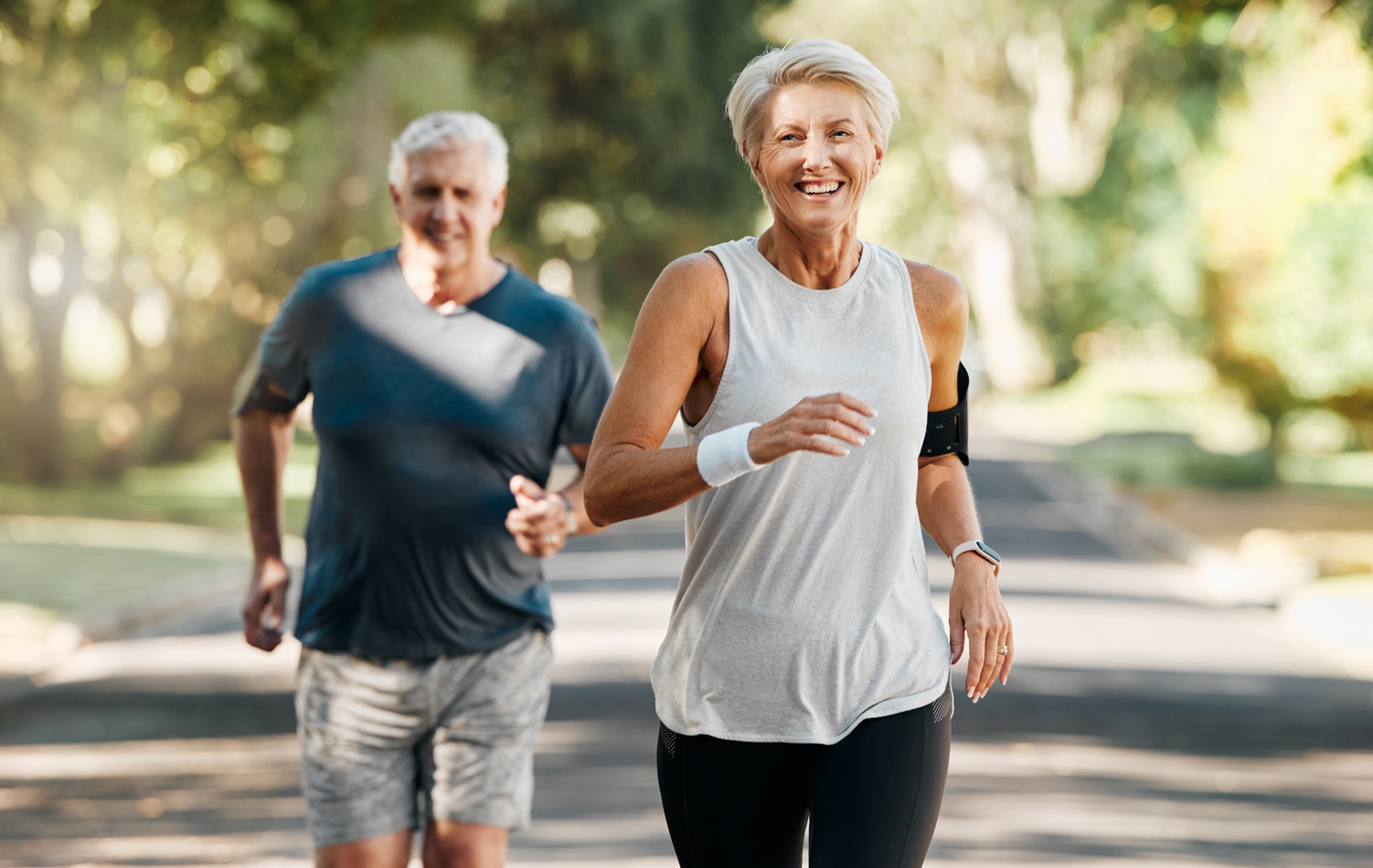 Couple running happily and enjoying retirement