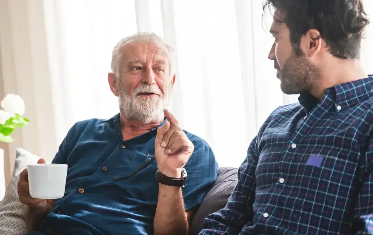 Senior man and young man talking
