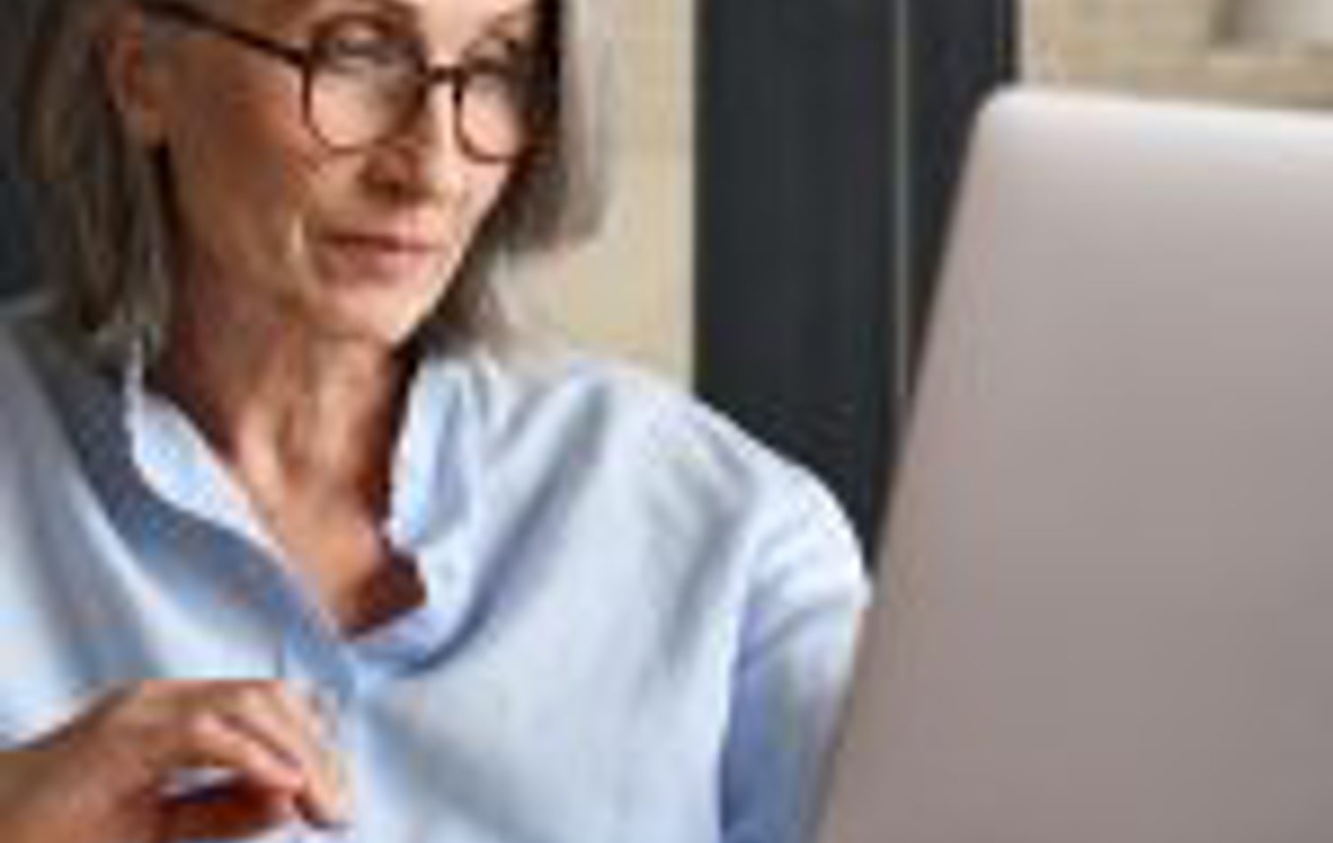 A woman looking at online pension planning 